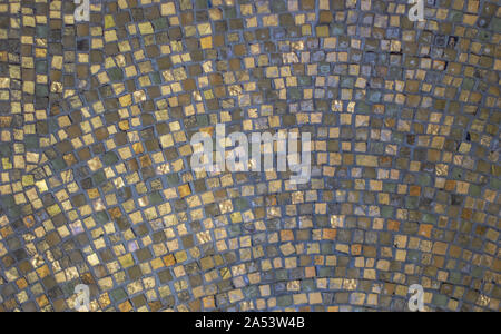 mosaic composed of small golden tiles. texture Stock Photo
