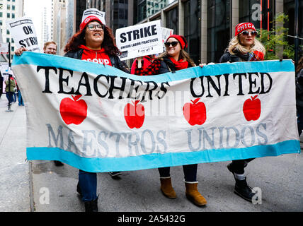 Chicago, USA. 17th Oct, 2019. Teachers take part in the Chicago Teachers' Union strike rally in downtown Chicago, the United States, on Oct. 17, 2019. Thousands of teachers and supporters rally on Thursday after Chicago Teachers' Union failed to make a deal with the municipal government on raising the teachers' salaries. Credit: Joel Lerner/Xinhua/Alamy Live News Stock Photo