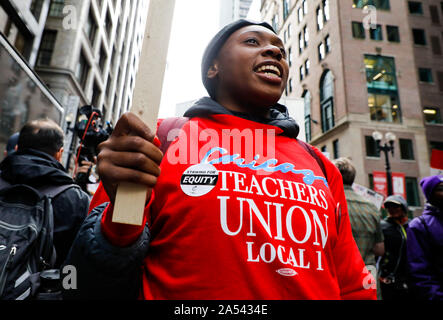 Chicago, USA. 17th Oct, 2019. A teacher takes part in the Chicago Teachers' Union strike rally in downtown Chicago, the United States, on Oct. 17, 2019. Thousands of teachers and supporters rally on Thursday after Chicago Teachers' Union failed to make a deal with the municipal government on raising the teachers' salaries. Credit: Joel Lerner/Xinhua/Alamy Live News Stock Photo