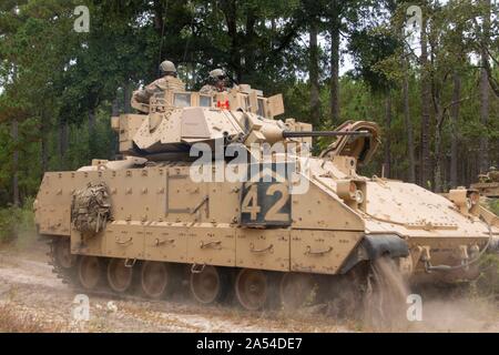 M2A2 Bradley Fighting Vehicle assigned to Bravo Troop, 6th Squadron, 8th Cavalry Regiment, 2nd Armored Brigade Combat Team, tactically conducts a route reconnaissance mission during Gila Focus at Fort Stewart, Ga., Oct 9. Bravo Troop supported the 9th Brigade Engineer Battalion and other Spartan units by carrying out Area, Zone, and Route Reconnaissance missions. (U.S. Army photo by Spc. Christian Davis/released) Stock Photo