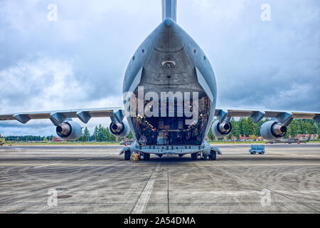 A C-17 Globemaster III based out of McChord AFB has main cargo door open at Gray AAF on Ft. Lewis Washington 12 April 2019. Stock Photo