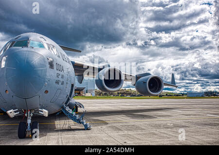 A C-17 Globemaster III based out of McChord AFB, WA sits under mostly cloudy skies at Gray AAF after accomplishing a training sortie over Eastern Washington on 12 April 2019. Stock Photo