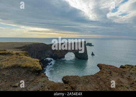 Famous Rock arch seen from Lighthouse near Vik,Iceland Stock Photo