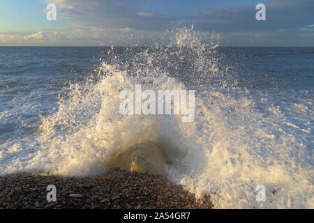 Wave splash on the rock on the Jurassic Coast in Devon Stock Photo