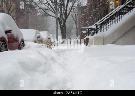 Street level shot during a blizzard with heavy snowfall in Harlem, NYC Stock Photo