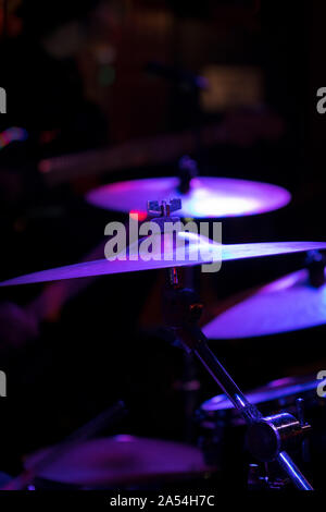 Closeup of cymbals on a stage, in a New York City nightclub