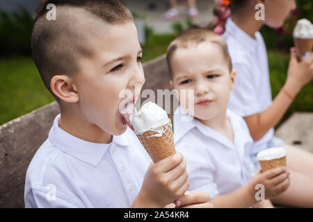 lovely brothers eating ice cream Stock Photo