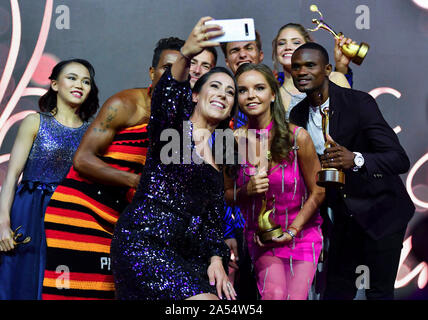 Doha, Qatar. 17th Oct, 2019. Awarded athletes take selfies during awarding ceremony of the ANOC Awards 2019 at the XXIV ANOC General Assembly Qatar 2019 in Doha, capital of Qatar, on Oct. 17, 2019. Credit: Nikku/Xinhua/Alamy Live News Stock Photo
