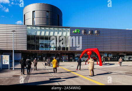 DEC 2, 2018 Hakodate, JAPAN - JR JR Hakodate Station building with tourists at front square under bright sunlight in winter Stock Photo