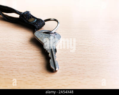 Silver key isolated on wood floor selective focus - busines, success and allow to access concept Stock Photo