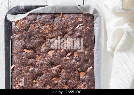 Chocolate brownie cake baked in baking tray just out of oven - Top view Stock Photo