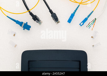Above view of telecommunication connector with black router. Stock Photo