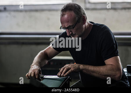 Grinded knifes at a professional sharpener in germany. Stock Photo