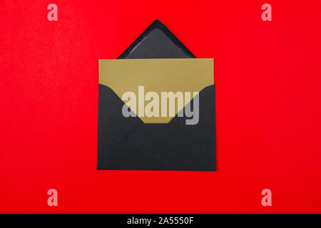 Junk mail or spam and fake letter idea. Concept for unsolicited mail or e-mail. Envelope on red background Stock Photo