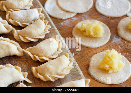 Preparation of vareniki  with mashed potatoes close up Stock Photo