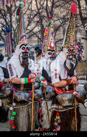 Mummers perform rituals to scare evil spirits at Surva festival at Pernik in Bulgaria. The people are called Kuker, kukeri. Stock Photo