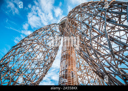 Doubravka lookout tower, view from bottom to the top. Wooden structure made of locust tree. At the edge of Prague. Nice sky in the background. Stock Photo