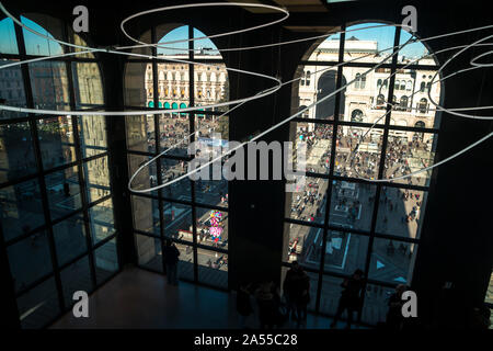 Milan, Italy - January 06, 2019: Big windows in Novecento museum of modern art with view on Duomo square. Stock Photo