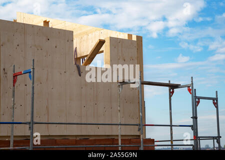 Construction of a wooden house, which are a more ecological and economic alternative than homes made of traditional brick and concrete Stock Photo