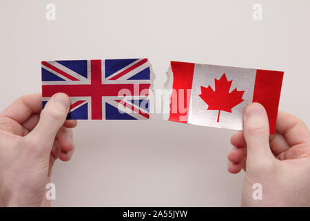 UK and Canada paper flags ripped apart. political relationship concept Stock Photo