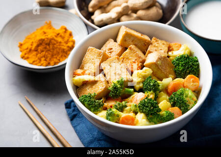 Stir fried tofu and vegetables with satay sauce in a bowl Stock Photo