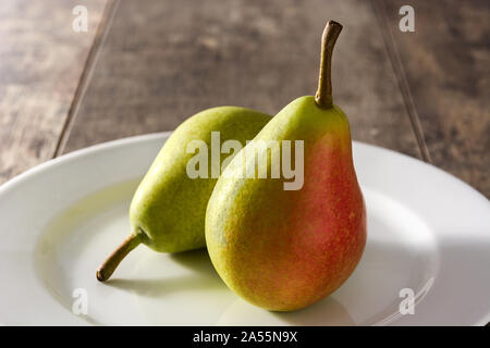 Two pears on wooden table Stock Photo