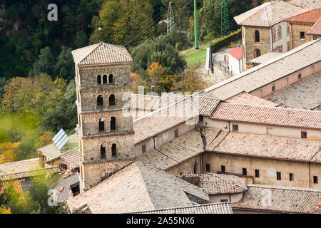 View of Saint Scholastica medieval monastery surrounded, by trees in Subiaco. Founded by Benedict of Nursia Stock Photo