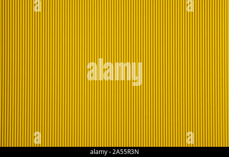 Corrugated cardboard paper yellow color background and texture, copy space. Stock Photo