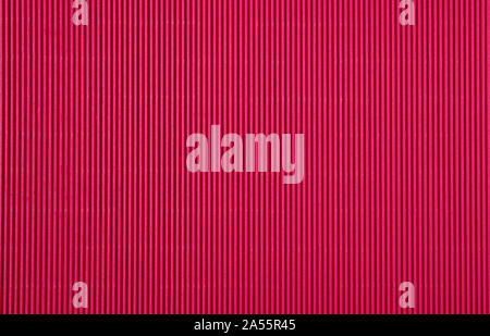 Corrugated cardboard paper magenta color background and texture, copy space. Stock Photo