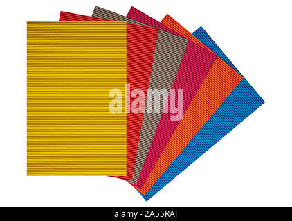 Colorful corrugated cardboard papers stack isolated against white background, copy space. Stock Photo