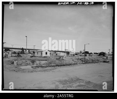 VIEW LOOKING SOUTHEAST TOWARD WEST SIDE OF SETTLING RESERVOIR NO. 1. THE BLAISDELL SLOW SAND FILTER WASHING MACHINE IS SEEN AT THE LEFT. MAIN STREET IS IN THE FOREGROUND. - Yuma Main Street Water Treatment Plant, Jones Street at foot of Main Street, Yuma, Yuma County, AZ Stock Photo