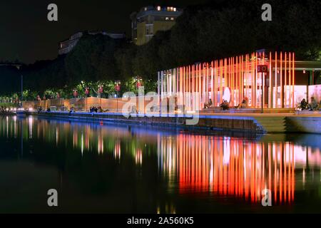 Horizontal shot of beautiful light effects reflected in the lake in Milan, Italy