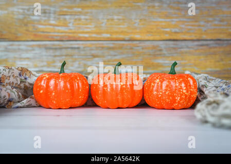 halloween background decorated holidays festive concept / pumpkin halloween decorations on white wooden background for party accessories object Stock Photo