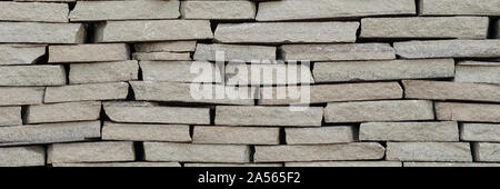 Background wall small light brown textural decorative brick Stock Photo