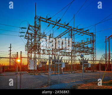 Electric substation at sunset with blue sky. Stock Photo