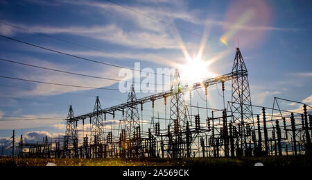 Sun setting over an electrical substation. Stock Photo