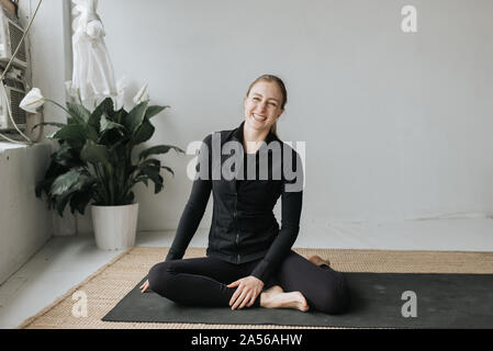 Portrait of woman in yoga studio Stock Photo