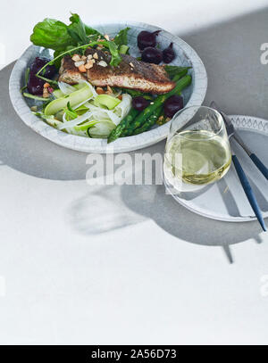 High key still life with barramundi lemon myrtle and native spices on white table Stock Photo