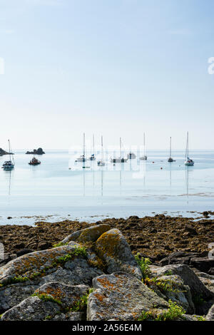 Boats at anchor in The Cove between St Agnes and Gugh, Isles of Scilly Stock Photo