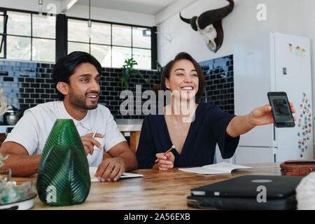 Colleagues having discussion in office Stock Photo