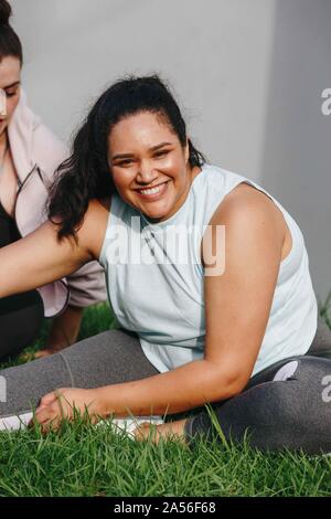 Woman doing stretching exercise in garden Stock Photo