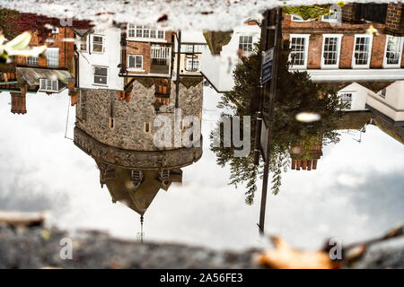 Reflections of buildings including Windsor castle in a puddle on the floor. Stock Photo