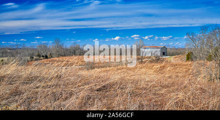 Tobacco Barn with Clouds and Blue Sky. Stock Photo
