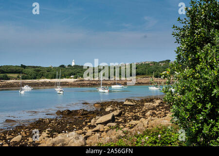 Boats at anchor in The Cove between St Agnes and Gugh, Isles of Scilly Stock Photo