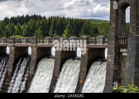 Water overflowing the dam at Alwen reservoir in North Wales Stock Photo