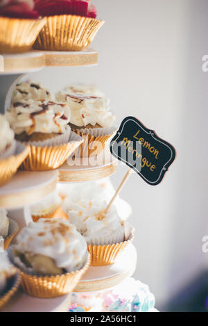Cupcakes on cake stand at wedding reception, close up detail Stock Photo