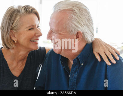 Loving senior couple talking at home Stock Photo