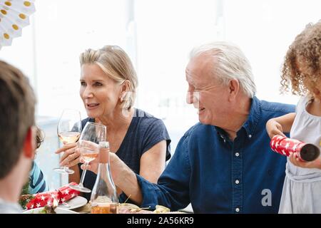 Family talking and bonding at home party Stock Photo