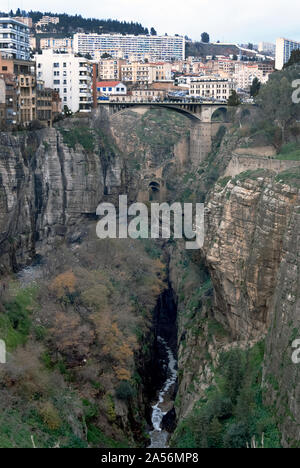 The modern bridge at the top and the ancient Roman Bridge over the river at the bottom of the large natural gorge which splits the city of Constantine, Algeria, December 2007. Stock Photo