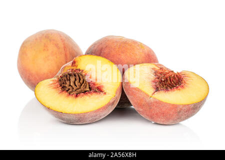 Group of two whole two halves of sweet red peach isolated on white background Stock Photo